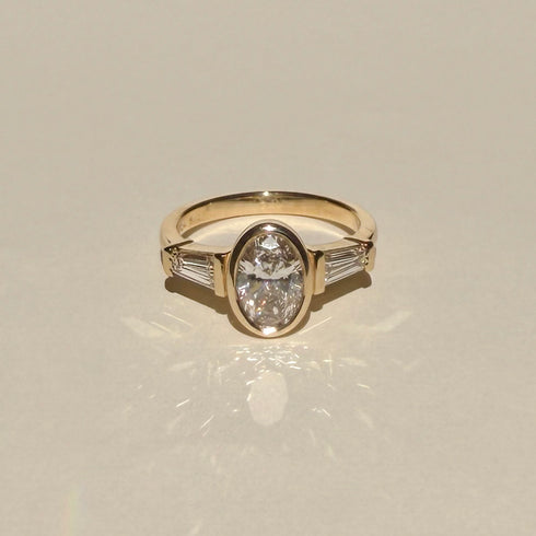 Bezel Set Oval and Tapered Baguette Lab Grown Diamonds Trilogy Ring