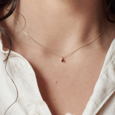 Three Claw Mini Garnet Pendant Charm in Yellow Gold