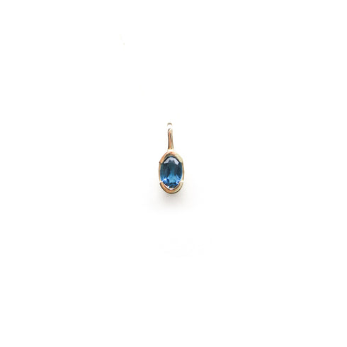 Partial Bezel Set Oval Blue Topaz in Yellow Gold