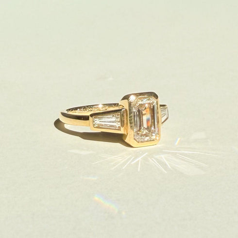 Bezel Set Emerald Lab Grown Diamond Trilogy Ring