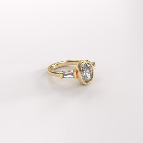 Bezel Set Oval and Tapered Baguettes Trilogy Lab Grown Diamond Ring