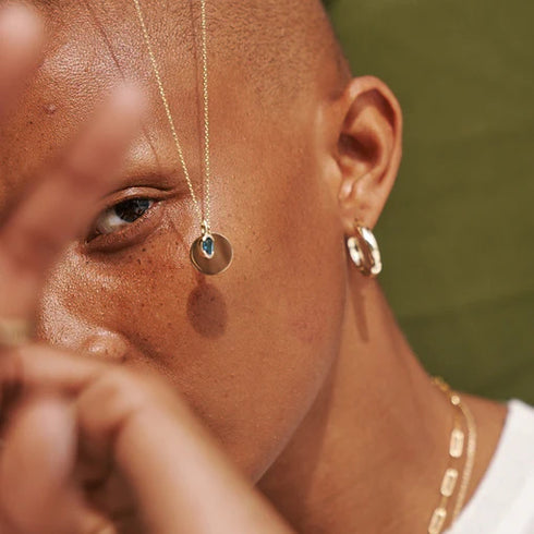 Partial Bezel Set Oval Blue Topaz in Yellow Gold