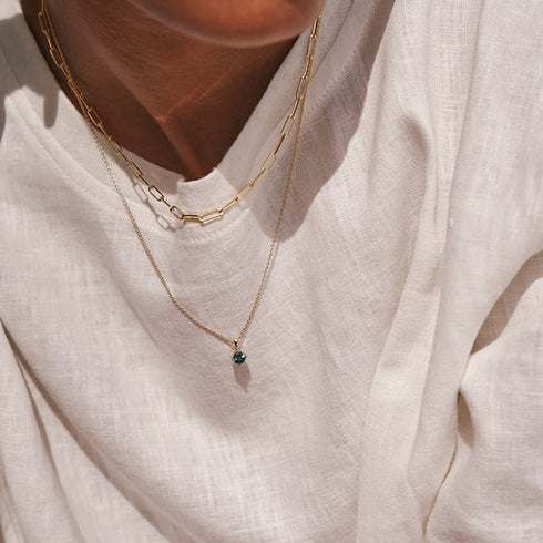 Four Claw Round Blue Topaz Pendant Charm in Yellow Gold