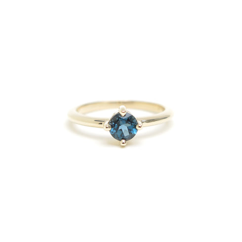 Four Claw Round Blue Topaz in Yellow Gold