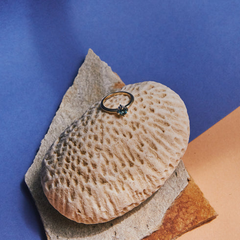 Four Claw Round Blue Topaz in Yellow Gold